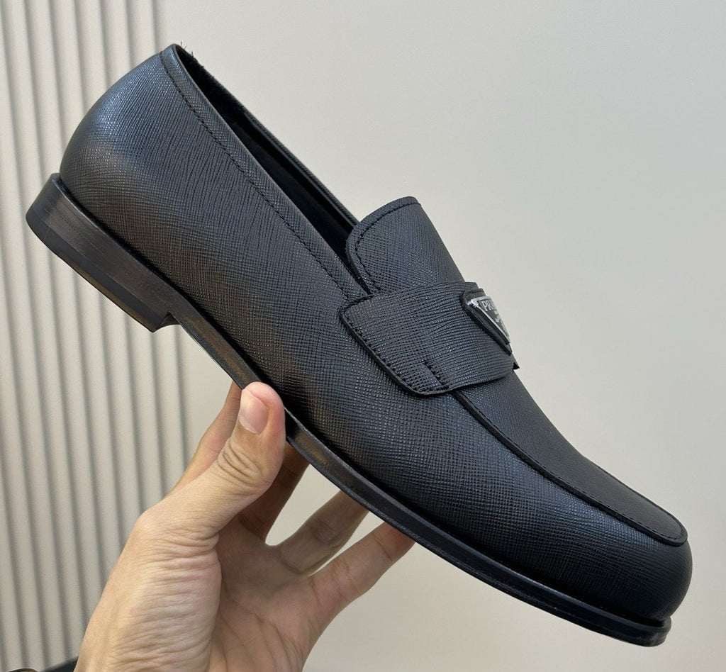 Prada Black Triangular Plaque Loafers — front